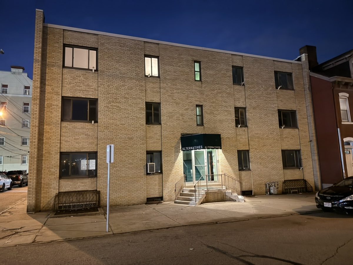 70 S 22nd St in Pittsburgh's South Side, a three-storey brick building in its former use as offices, before conversion.